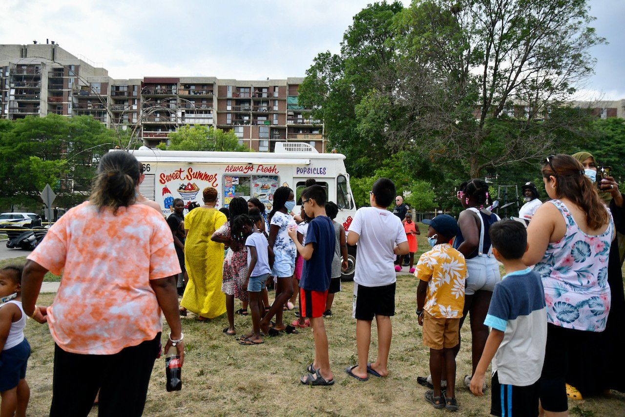 people lined up for ice cream