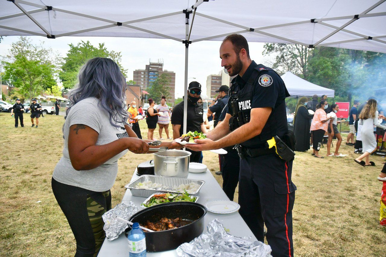 community member serving food