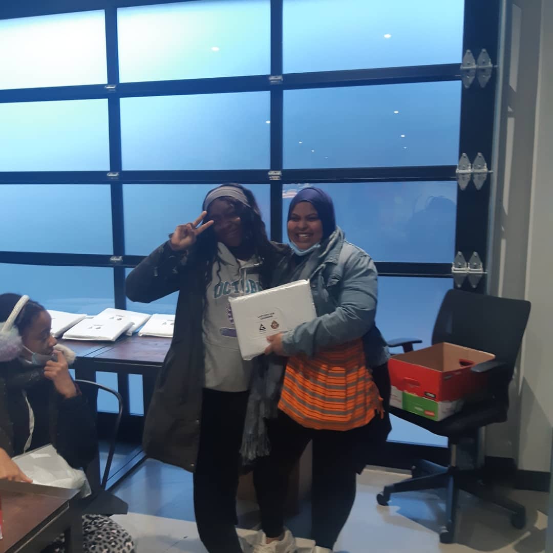 Youth receiving laptops
