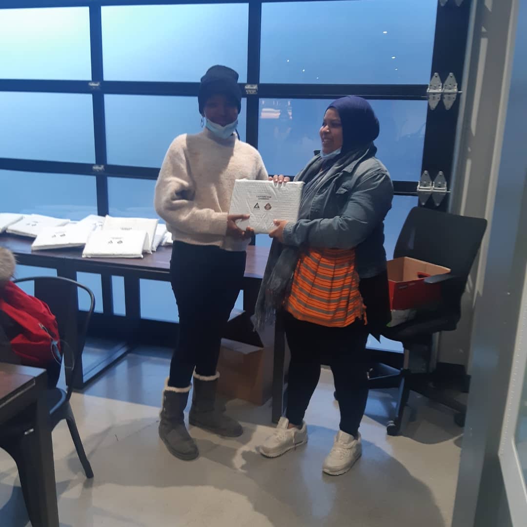 Youth receiving laptops