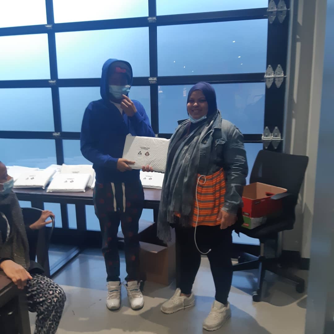 Youth receiving laptops