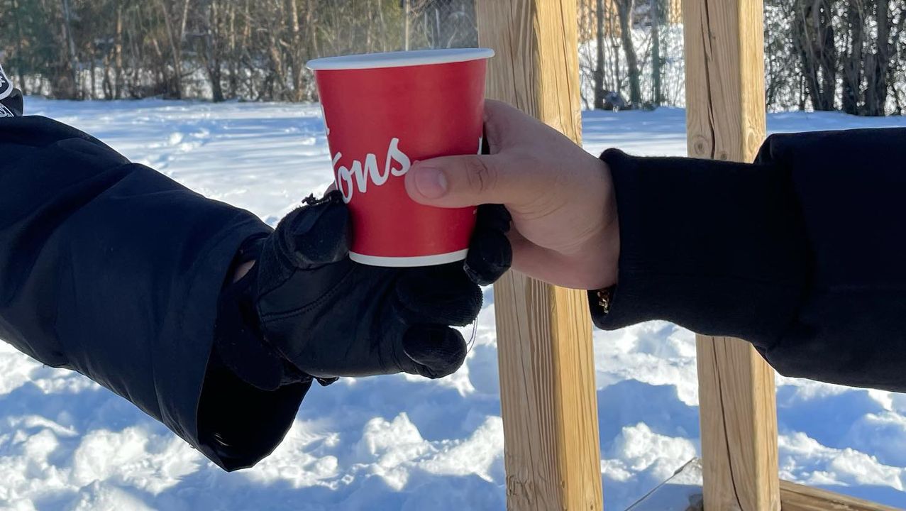 Giving coffee to officer