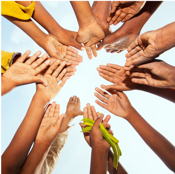 Join us - children putting hands together.