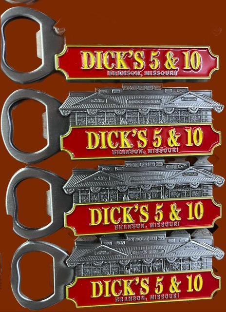 Four bottle openers with red signs reading 
