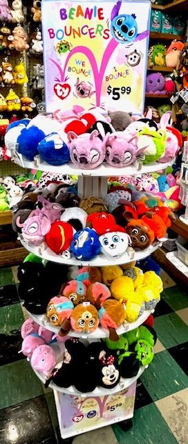 A retail display stand filled with colorful