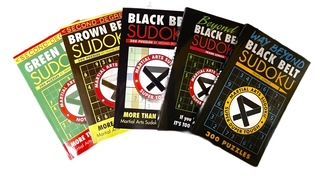Five martial arts-themed Sudoku puzzle books arranged in a row, ranging from green to brown and black belt difficulty.