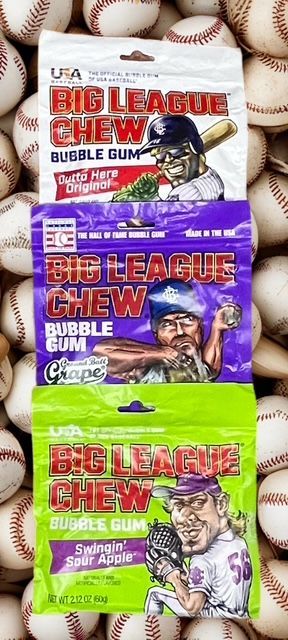 Three pouches of Big League Chew bubble gum—Original, Grape, and Sour Apple—stacked against a background of baseballs.