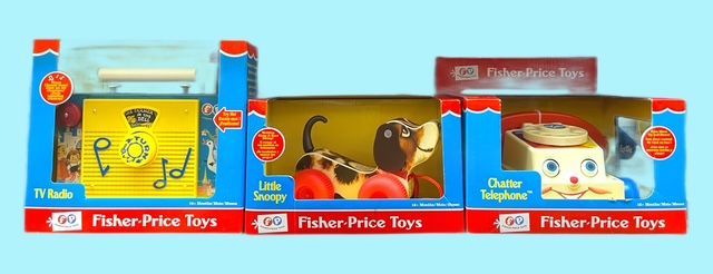 Three boxed Fisher-Price classic toys: a TV-Radio, a Little Snoopy pull toy, and a Chatter Telephone.