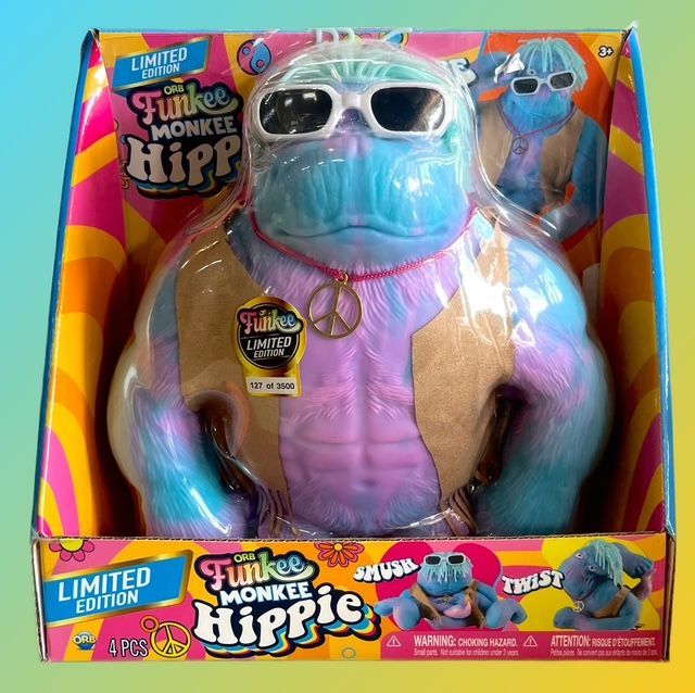 A limited-edition Funkee Monkee Hippie toy with pastel blue and pink fur, white sunglasses, and a gold peace sign necklace.