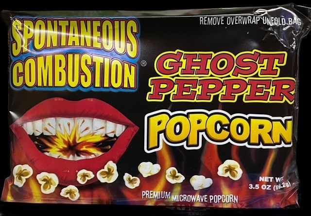 A package of Spontaneous Combustion Ghost Pepper microwave popcorn with a graphic of lips and flames.