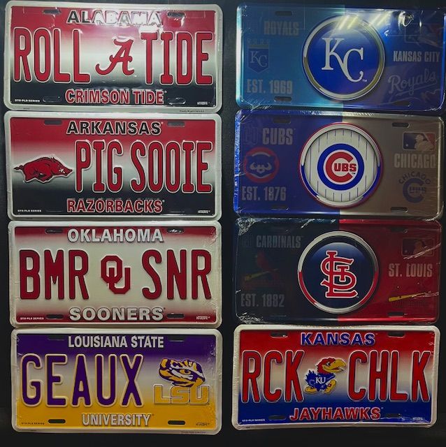 A grid of eight sports-themed decorative license plates featuring college and professional team logos and slogans.