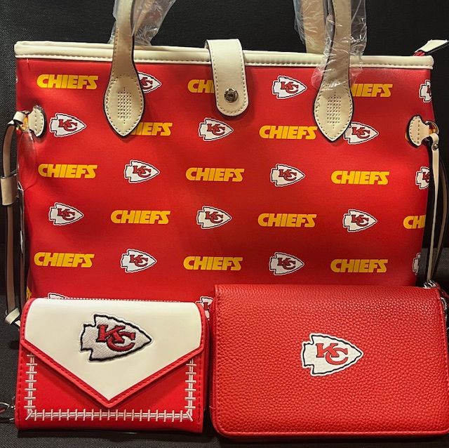 A Kansas City Chiefs themed set featuring a red patterned tote bag, a white and red wallet, and a solid red clutch.