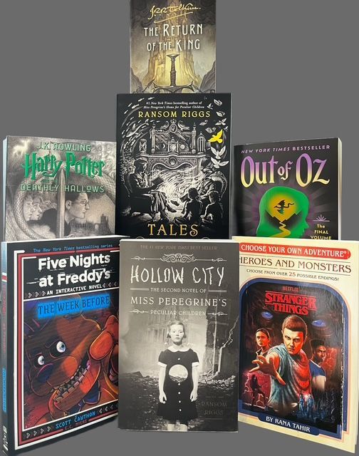 A stacked collection of seven books, including titles like The Return of the King, Hollow City, and Five Nights at Freddy’s.