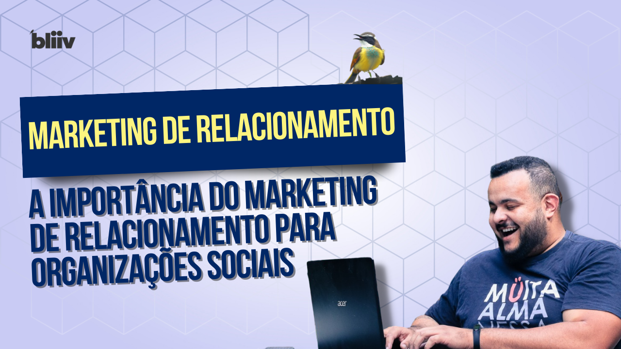 Um homem vestindo uma camisa que diz muita alma está digitando em um laptop