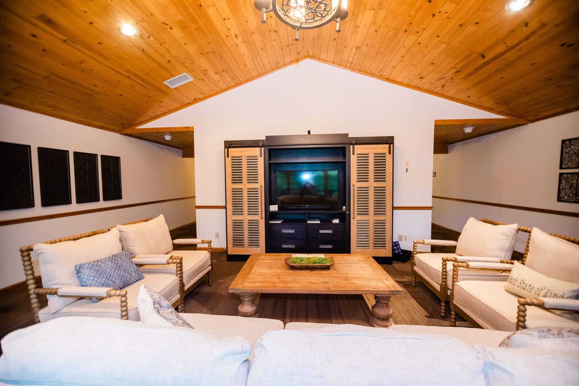 A living room filled with furniture and a flat screen tv.