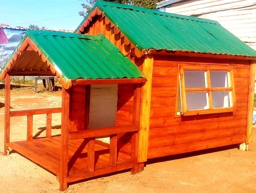 A small wooden house with a green roof from Pets and the City in Pretoria East.