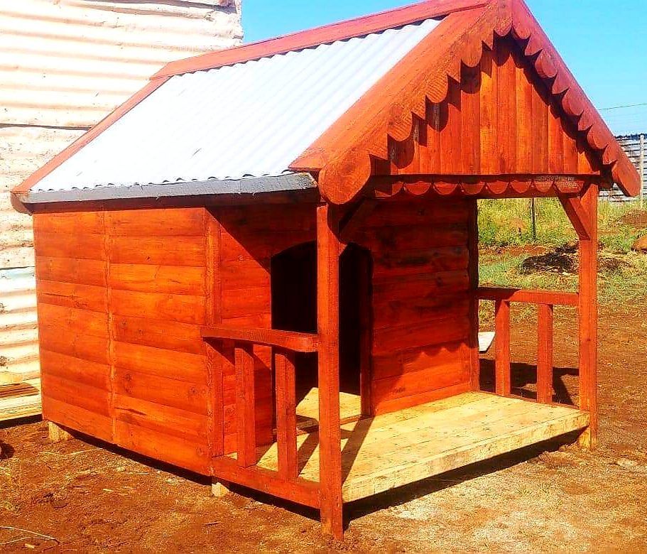 A small wooden house with a metal roof available at Pets and the City in Pretoria East.