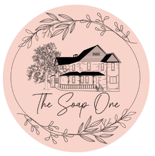 Pink circular logo: sketched house, tree, floral border, "The Soap One" text.
