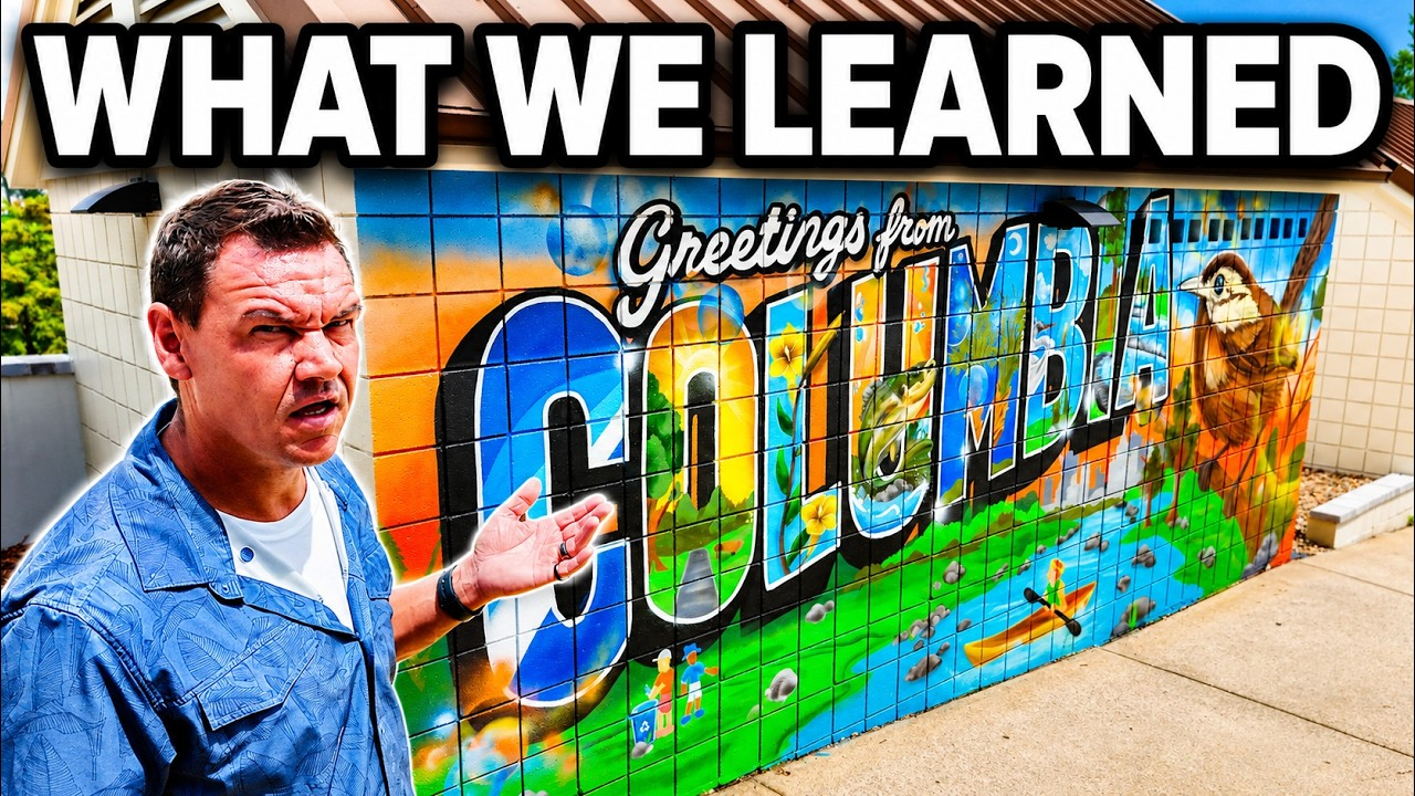 Man in blue shirt pointing at colorful “Greetings from Cudahy” mural with “WHAT WE LEARNED” text