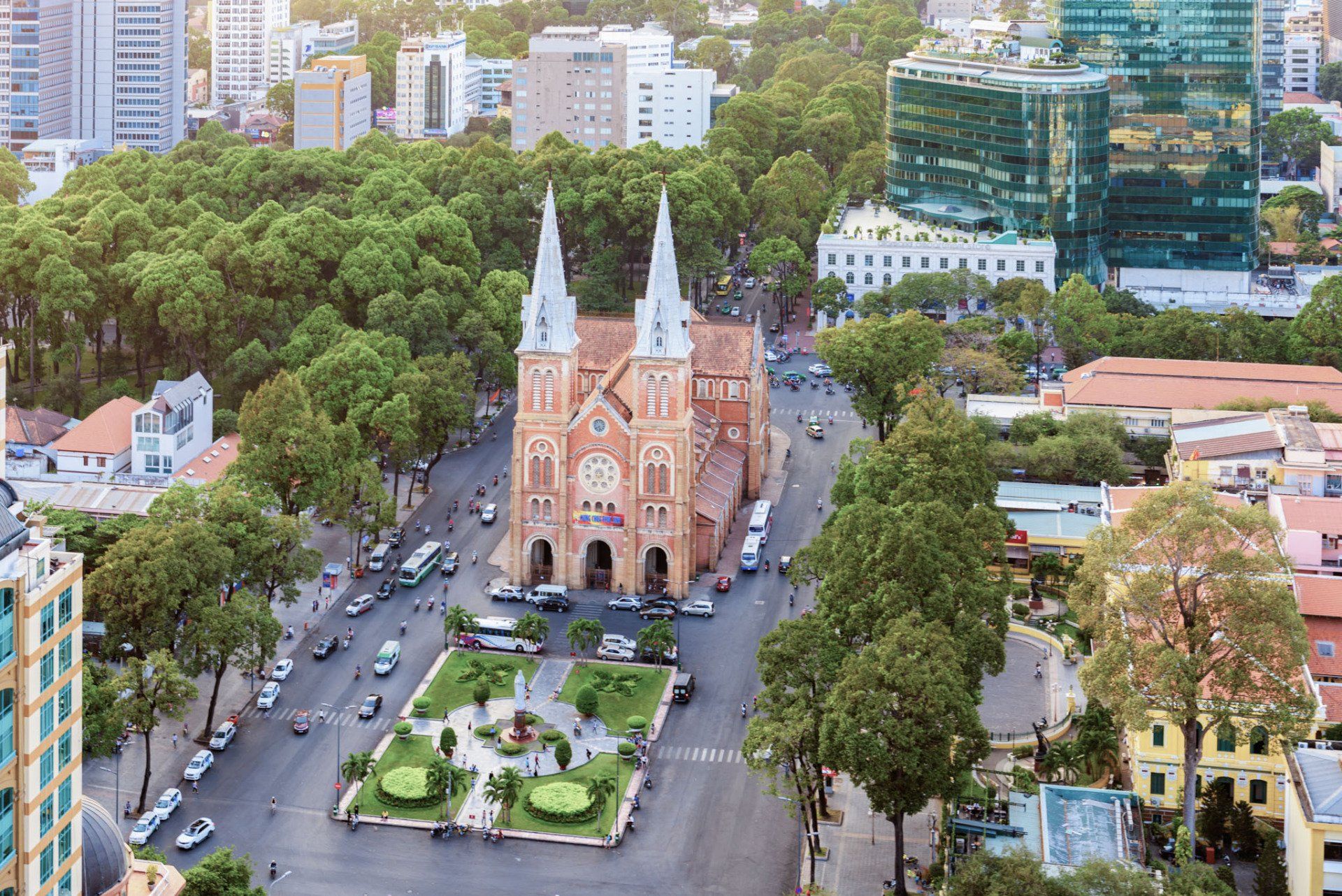 An aerial view of a city with a church in the middle of it