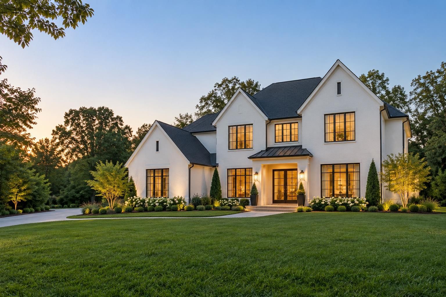 Illustrative upscale white home with warm evening light