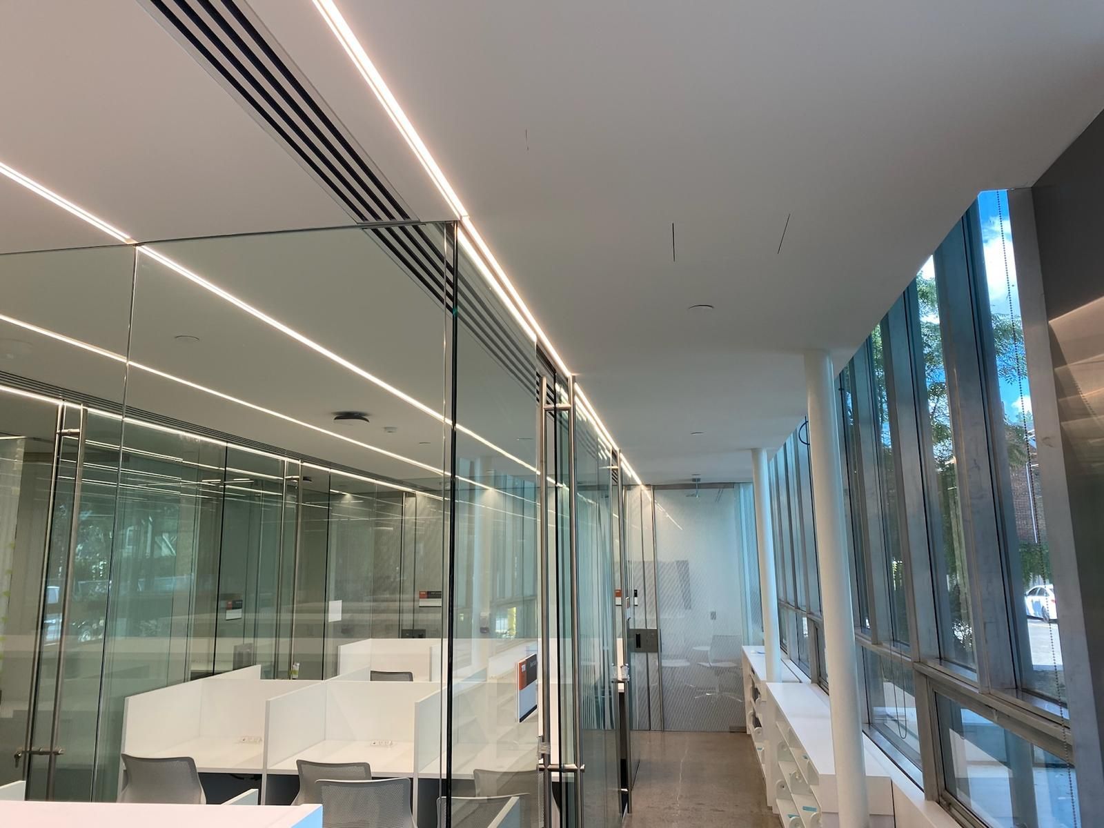 A large room with a lot of windows and glass walls.