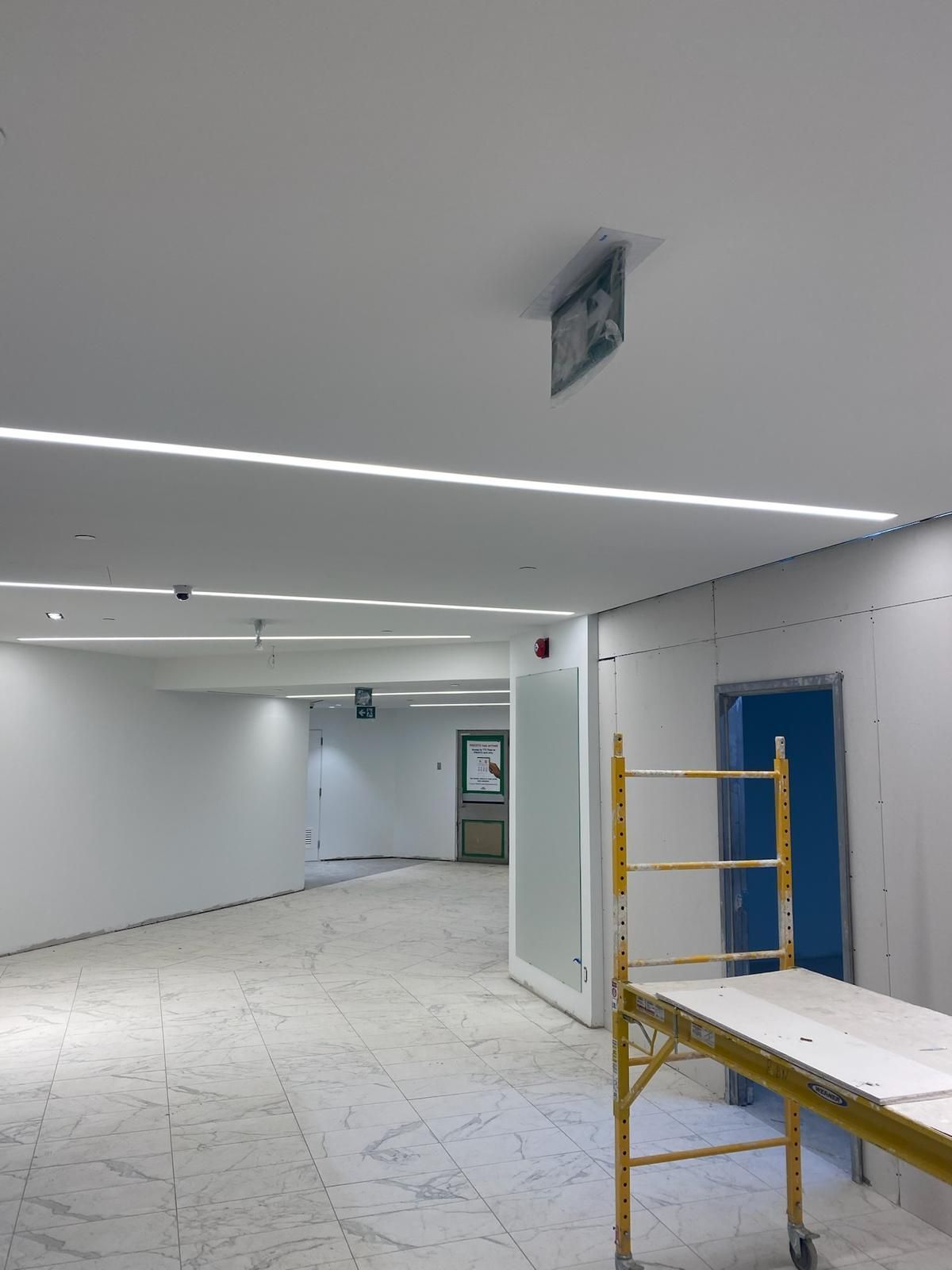 A large empty room with a scaffolding in the middle
