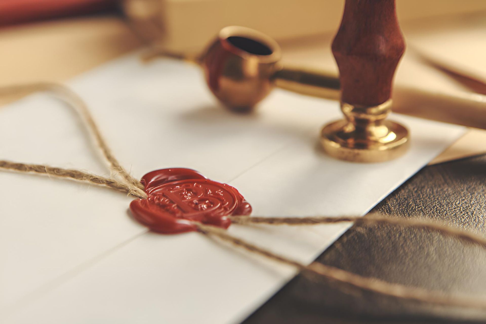 A Letter With a Red Wax Seal and a Stamp on It — Bradley J Bragg - Solicitor in Atherton, QLD