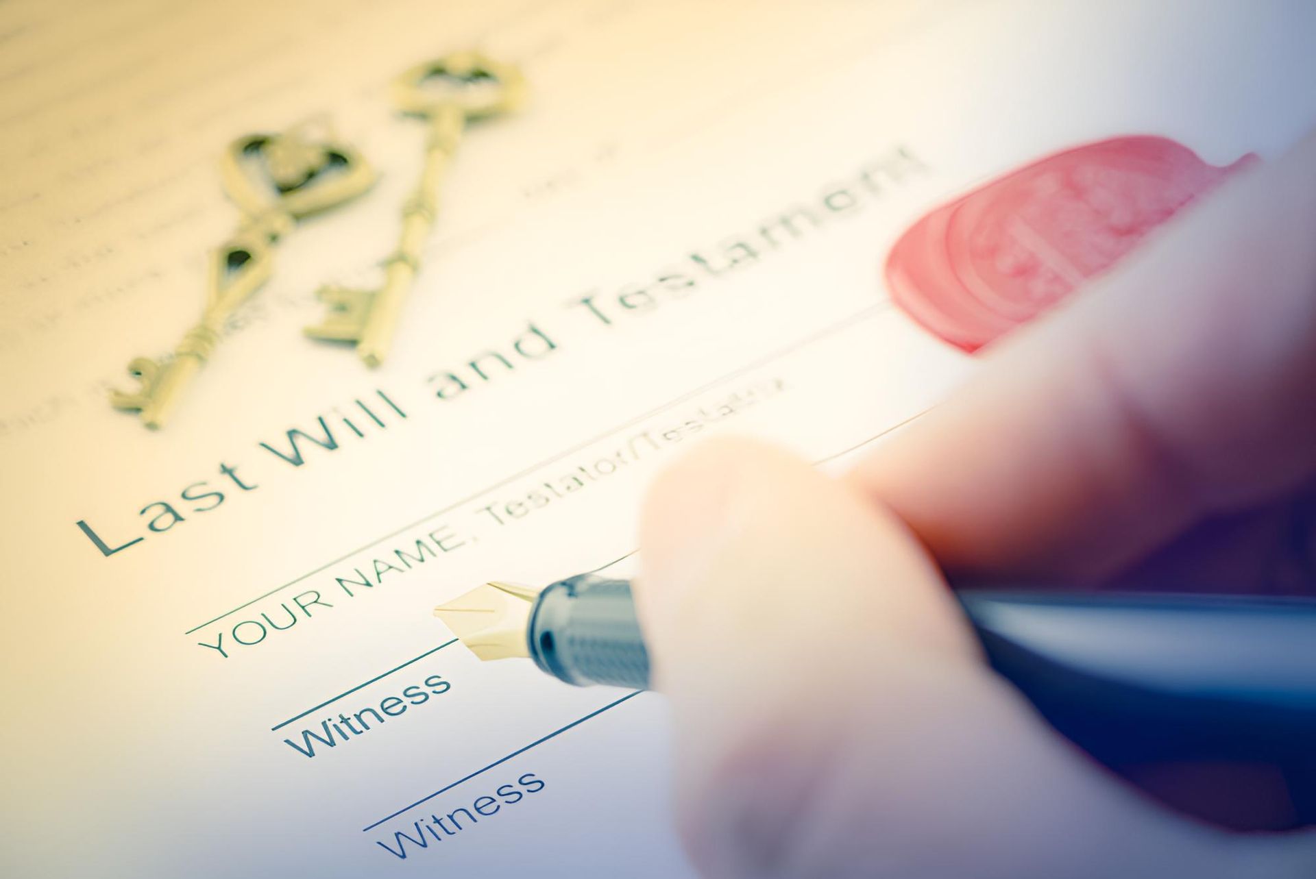 A Person is Signing a Last Will and Testament With a Pen — Bradley J Bragg - Solicitor in Atherton, QLD
