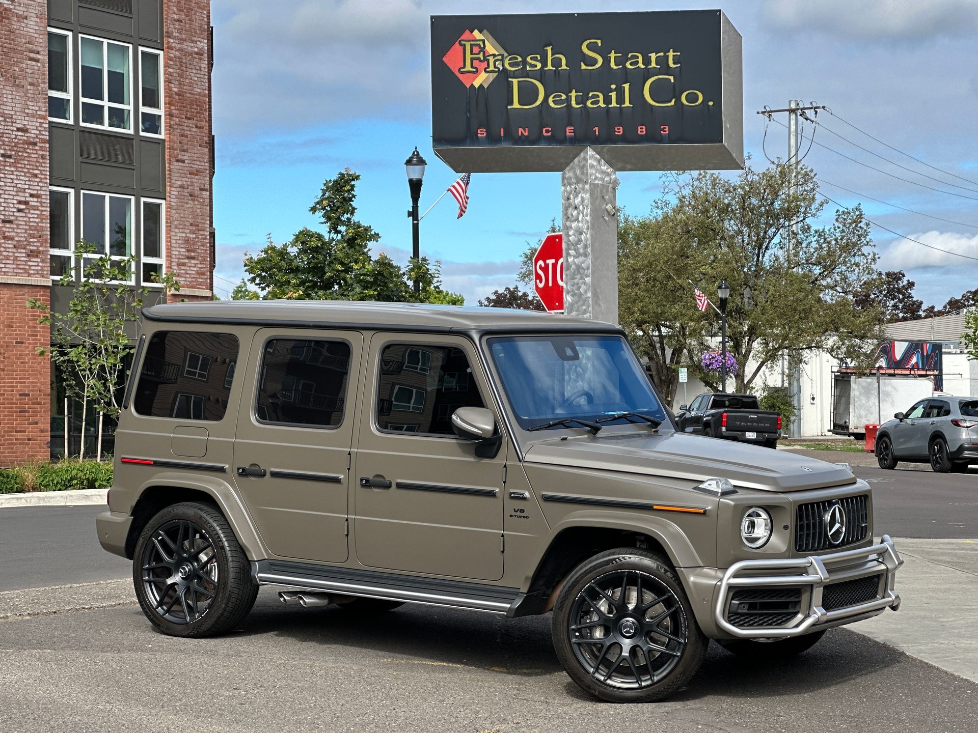 Magno green AMG Mercedes with a ceramic coating parked at Fresh Start Detail & Ceramic Coating Co.