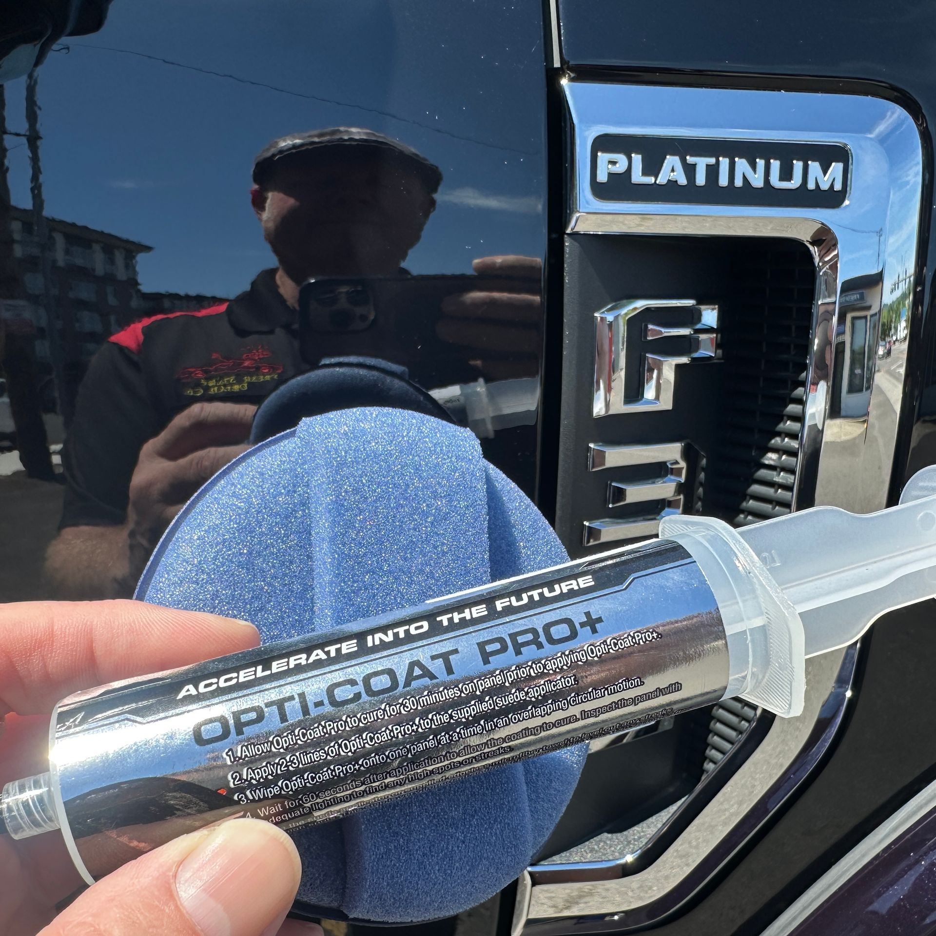 opti coat pro plus ceramic coating being applied to black Ford f350 platinum