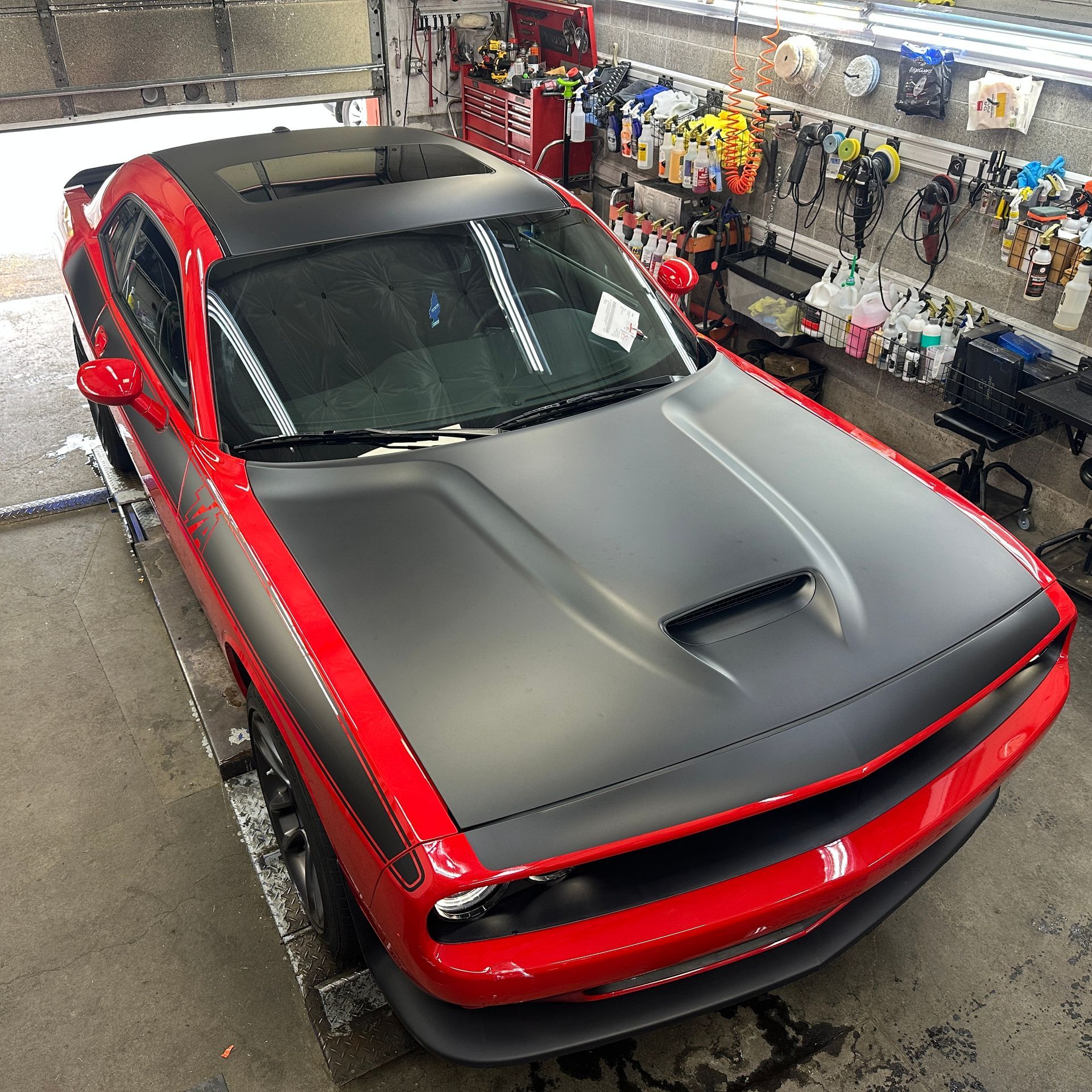 Red Dodge Challenger with black satin painted hood and graphics with a ceramic coating from Fresh Start Detail & Ceramic Coating Co. in Beaverton