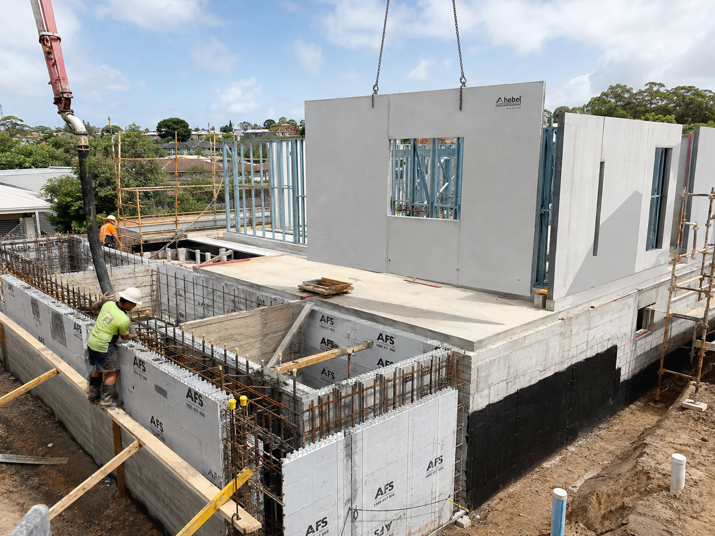 # Hebel and AFS: Two Smarter Ways to Build
Construction is constantly balancing the same pressures: build faster, control labour costs, meet increasingly demanding performance requirements and still deliver a building that feels solid and is made to last.
That is where two CSR building systems—**Hebel® Autoclaved Aerated Concrete (AAC)** and **AFS permanent formwork**—have become increasingly familiar on Australian construction sites.
They are very different products, but they share a common goal: making complex wall construction simpler, faster and more efficient.
For builders, engineers, architects and contractors across Victoria, understanding where each system works best can make a significant difference to the way a project is designed and delivered.
## So, What Exactly Is Hebel?
Hebel is a form of **Autoclaved Aerated Concrete, or AAC**. During manufacture, tiny air pockets are created throughout the concrete, producing a material that is considerably lighter than conventional concrete while retaining the strength needed for a wide range of construction applications.
CSR states that AAC is approximately **one-fifth the weight of regular concrete**. Hebel is manufactured as blocks and steel-reinforced panels and can be used for external and internal walls, party walls, floors, fire walls, shaft walls, facades, acoustic barriers and other applications.
That lightweight construction is one of Hebel's biggest advantages on site.
Instead of laying hundreds or thousands of individual bricks, large-format panels can cover a significant area in a relatively short period of time. CSR notes that installing one standard Hebel panel can replace the laying of approximately 75 standard bricks, while its PowerPanelXL system can be installed substantially faster than conventional brick construction.
But speed is only part of the story.
### Why builders choose Hebel
**Thermal performance**
Those tiny air pockets inside AAC help provide excellent thermal insulation. Hebel wall systems can help reduce heat transfer through the building envelope, contributing to cooler interiors in summer and warmer interiors during winter.
For Victorian buildings, where temperatures can shift considerably between seasons—and sometimes during the same day—that thermal performance is particularly valuable.
**Acoustic performance**
The cellular structure of AAC also provides useful acoustic properties. Hebel systems are used extensively for apartment separation walls, corridors, external walls and other locations where controlling noise transmission matters.
**Fire resistance**
Hebel is a **non-combustible building material**. Depending on the particular Hebel system and wall configuration, CSR publishes Fire Resistance Levels ranging from 60 to 240 minutes.
That makes it particularly useful in applications such as party walls, fire walls, shaft walls and multi-residential construction.
**A solid wall without conventional concrete weight**
Hebel panels incorporate steel reinforcement while remaining much lighter than standard concrete. This combination gives builders a material that feels substantial once installed while being easier to handle during construction.
## Then There Is AFS
Where Hebel provides lightweight AAC panels and blocks, **AFS provides permanent formwork systems used to create reinforced concrete structural walls**.
Instead of constructing temporary formwork, pouring the concrete and then stripping that formwork away, the AFS components remain as part of the completed wall.
AFS currently offers systems including **Rediwall® and Logicwall®**, each designed for different applications.
### AFS Rediwall®
Rediwall is a permanent formwork system made from prefabricated interconnecting components that snap or slide together before being reinforced and concrete-filled.
It is commonly used for applications including:
* Basements
* Retaining walls
* Foundation walls
* Blade walls
* Columns
* Party walls
* Retention tanks
* Planter boxes
* Service and stormwater pits
Once concrete-filled and appropriately reinforced, the system creates a structural reinforced-concrete wall.
AFS states that Rediwall can reduce installation time by up to half compared with traditional masonry and blockwork methods. It is CodeMark Certified and designed for reinforced concrete walls in accordance with AS 3600.
For basement construction in particular, the appeal becomes obvious: **form the wall, reinforce it, fill it and leave the formwork in place.**
There is no conventional formwork stripping process afterwards.
## AFS Logicwall®
Logicwall takes a slightly different approach.
It consists of lightweight prefabricated panels manufactured using **fibre-cement sheets bonded to galvanised steel stud frames**. The panels are erected on site and then core-filled with concrete to create the structural wall.
Because panels can arrive manufactured and labelled according to shop drawings, there can be considerably less measuring, cutting and traditional wall construction required on site.
Once installed and filled, the fibre-cement faces remain in place and provide a substrate that can receive finishes such as skim coating, acrylic render or paint.
AFS identifies benefits including faster construction, reduced on-site waste, reduced materials handling and fewer trades compared with some conventional wall construction methods.
## Hebel or AFS? It Doesn't Always Have to Be One or the Other
This is where these products become particularly interesting.
Hebel and AFS are not necessarily competing solutions.
They can perform completely different jobs within the same building.
Imagine a multi-residential project.
AFS might be used to create reinforced concrete basement walls, retaining walls, lift cores or structural walls where significant structural capacity is required.
Move further up the building and Hebel may be used for external walling, party walls, corridors, fire-rated walls or other applications where a lightweight panel system with strong thermal, acoustic and fire performance is desirable.
CSR itself notes that AFS is regularly specified alongside other products within the CSR family, including Hebel.
It is less about finding one material that does everything and more about **putting the right building system in the right part of the structure**.
## The Bigger Benefit: Construction Efficiency
The most interesting thing about both systems may actually be what they remove from the traditional construction process.
Hebel can reduce the amount of individual masonry units that need to be laid.
AFS permanent formwork can reduce conventional forming and stripping.
Logicwall panels can arrive manufactured to project requirements and labelled for installation.
Rediwall components interconnect to quickly create the permanent form before concrete placement.
That can translate into fewer individual construction steps, easier materials handling, reduced site waste and potentially faster progress through critical stages of the build.
And on a commercial construction project, every unnecessary handling process, additional trade and extra day on the programme can have a flow-on effect.
## Performance Still Comes First
Speed is valuable, but construction systems still need to perform.
Both Hebel and AFS have extensive technical documentation covering structural design, fire resistance, acoustics, thermal performance, installation and compliance.
The important point is that these performances are **system-specific**.
A particular fire rating, acoustic rating or structural capacity should never simply be assumed because a project specifies 