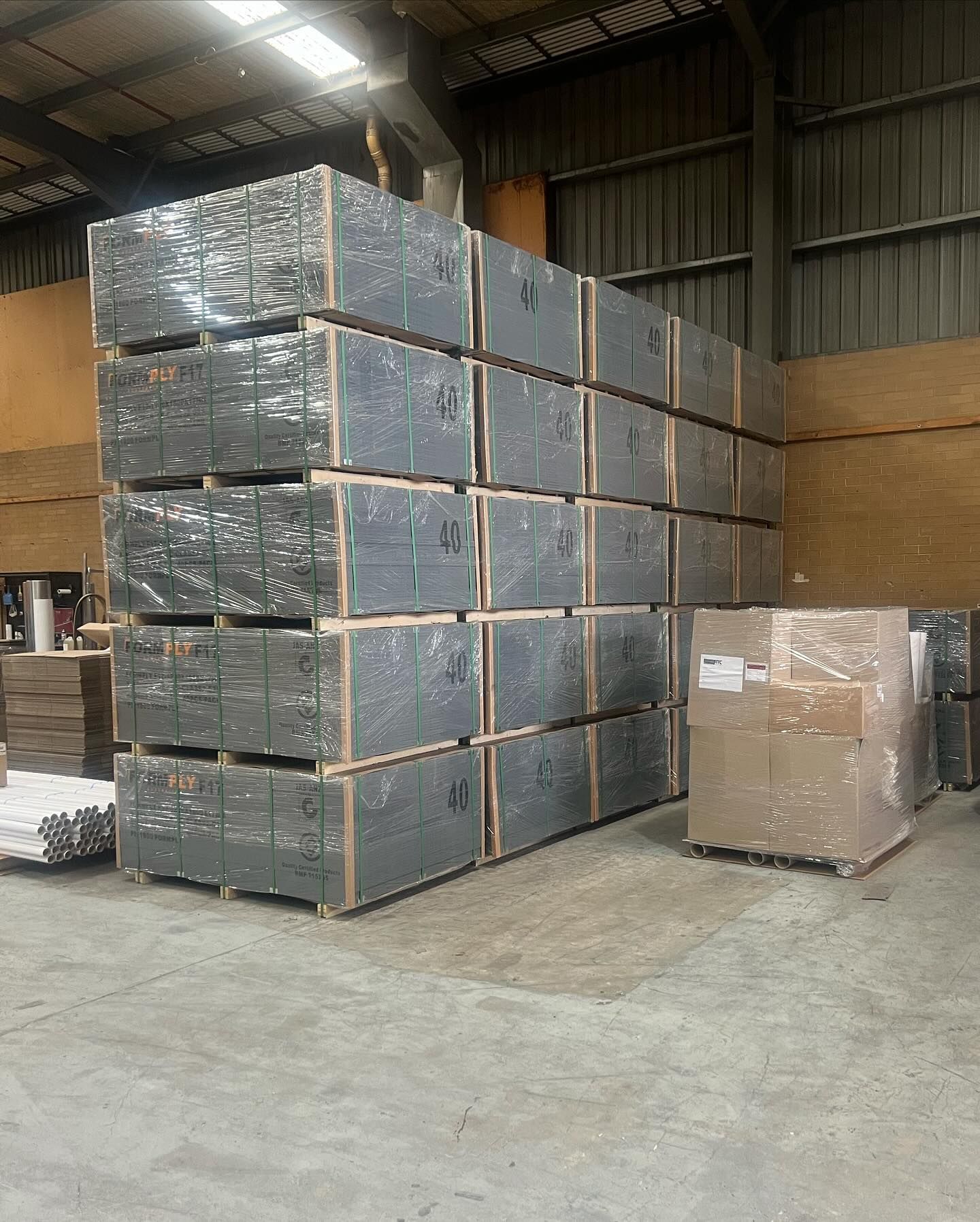A warehouse filled with lots of boxes stacked on top of each other