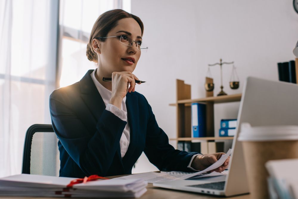 Woman in Glasses Working at a Desk in a Bright Office — Trapski Family Law Geelong in Newtown, VIC