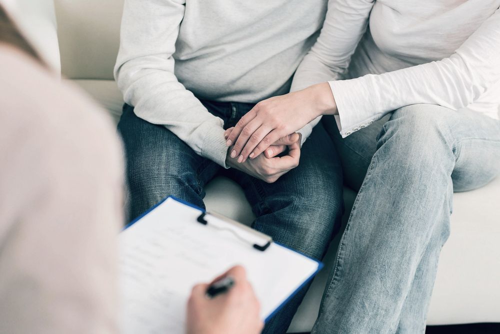 Two People Sitting on a Couch During a Counseling Session — Trapski Family Law Geelong in Newtown, VIC