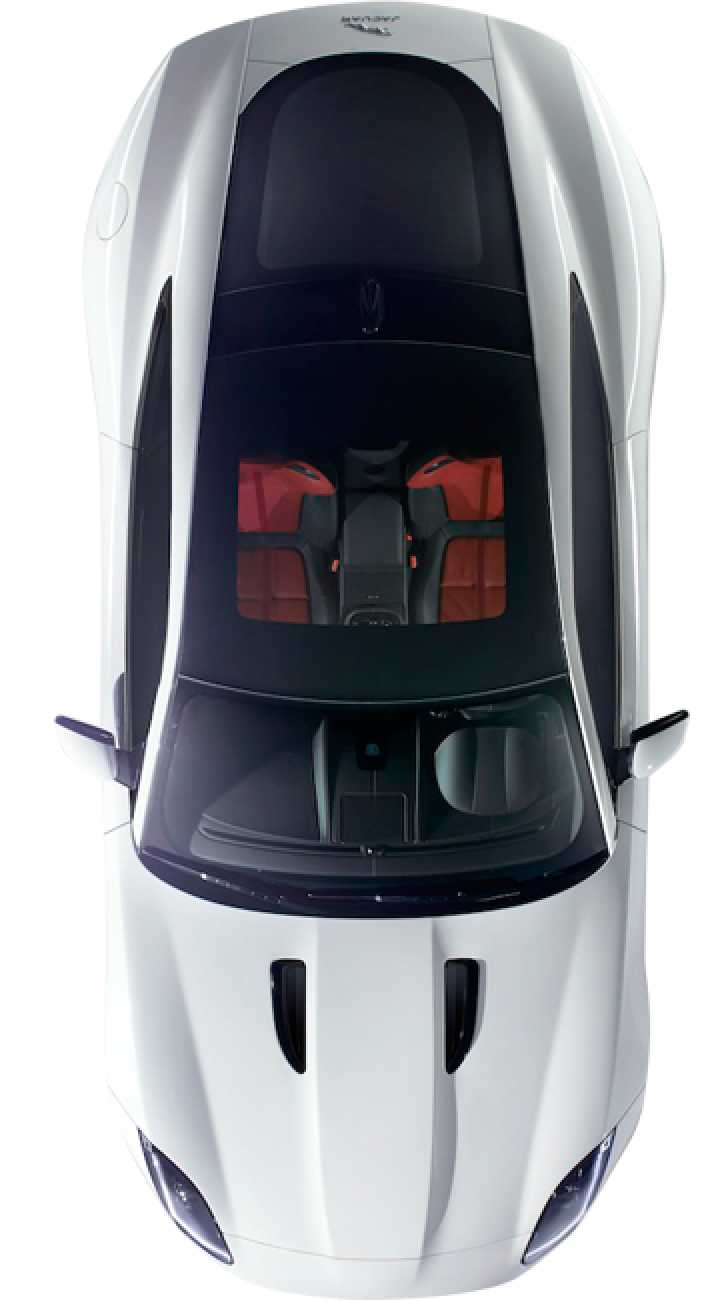 An aerial view of a white sports car with red seats | The Shop Norcross