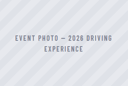 Event photo—2026 driving experience text on a light gray striped background