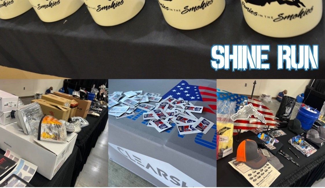 Shine Run table display with event items, flyers, and American flag-themed handouts on a black tablecloth