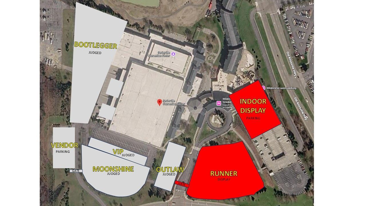 Aerial site map of a building complex with red and yellow highlighted zones and labels.