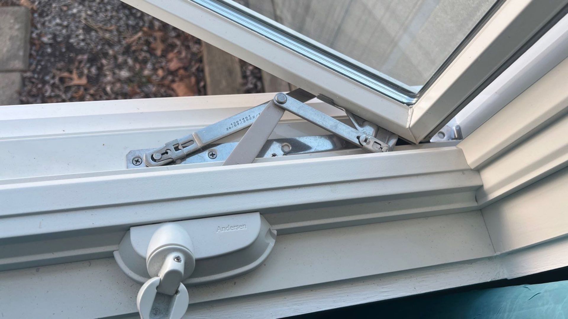 Worker installing new window in house
