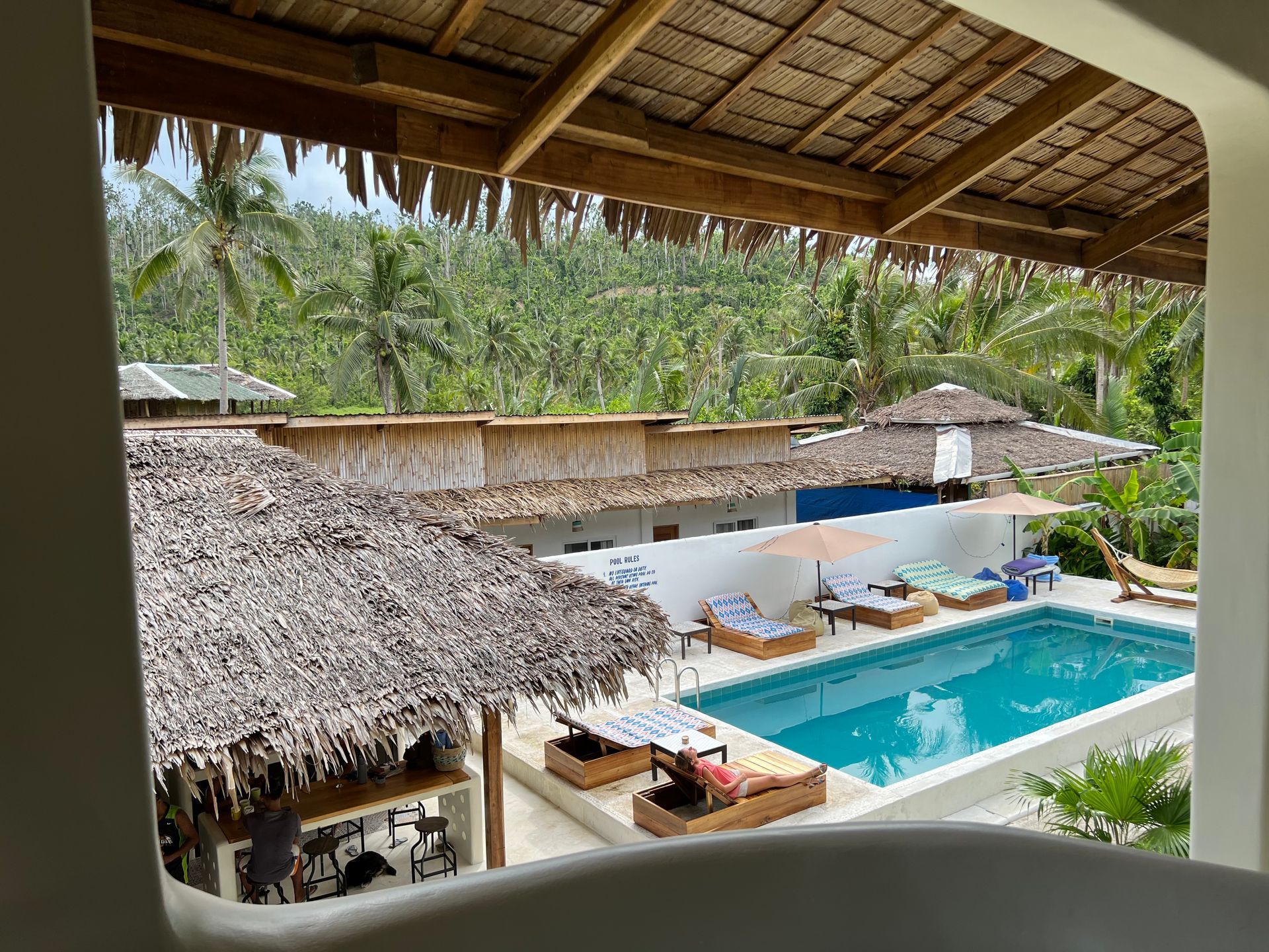 A view of a swimming pool from a balcony.