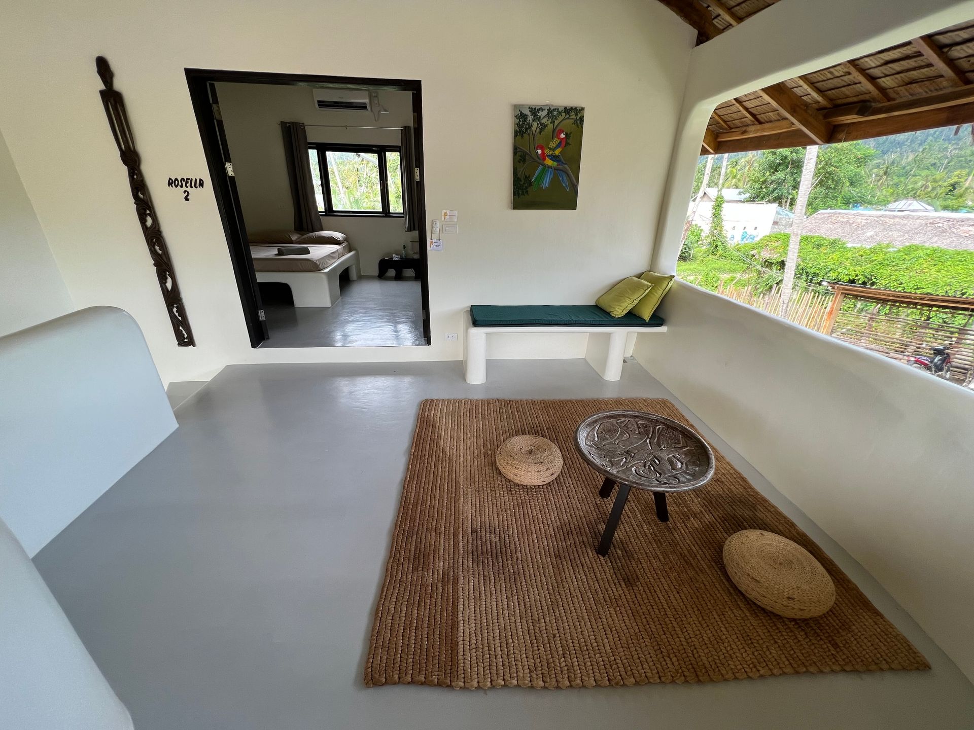 A living room with a couch a table and a rug