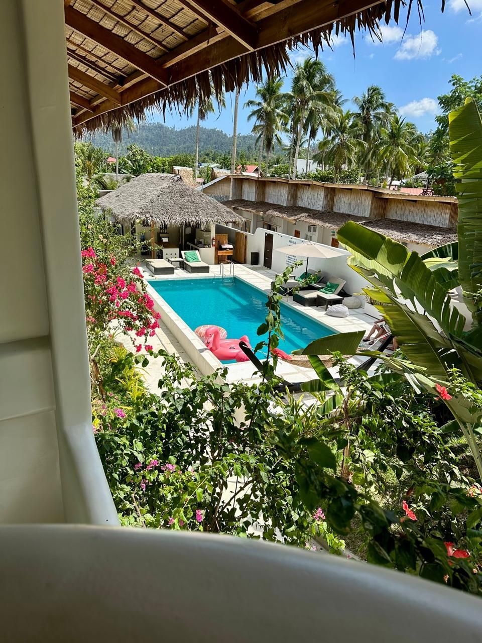 A view of a swimming pool from a balcony