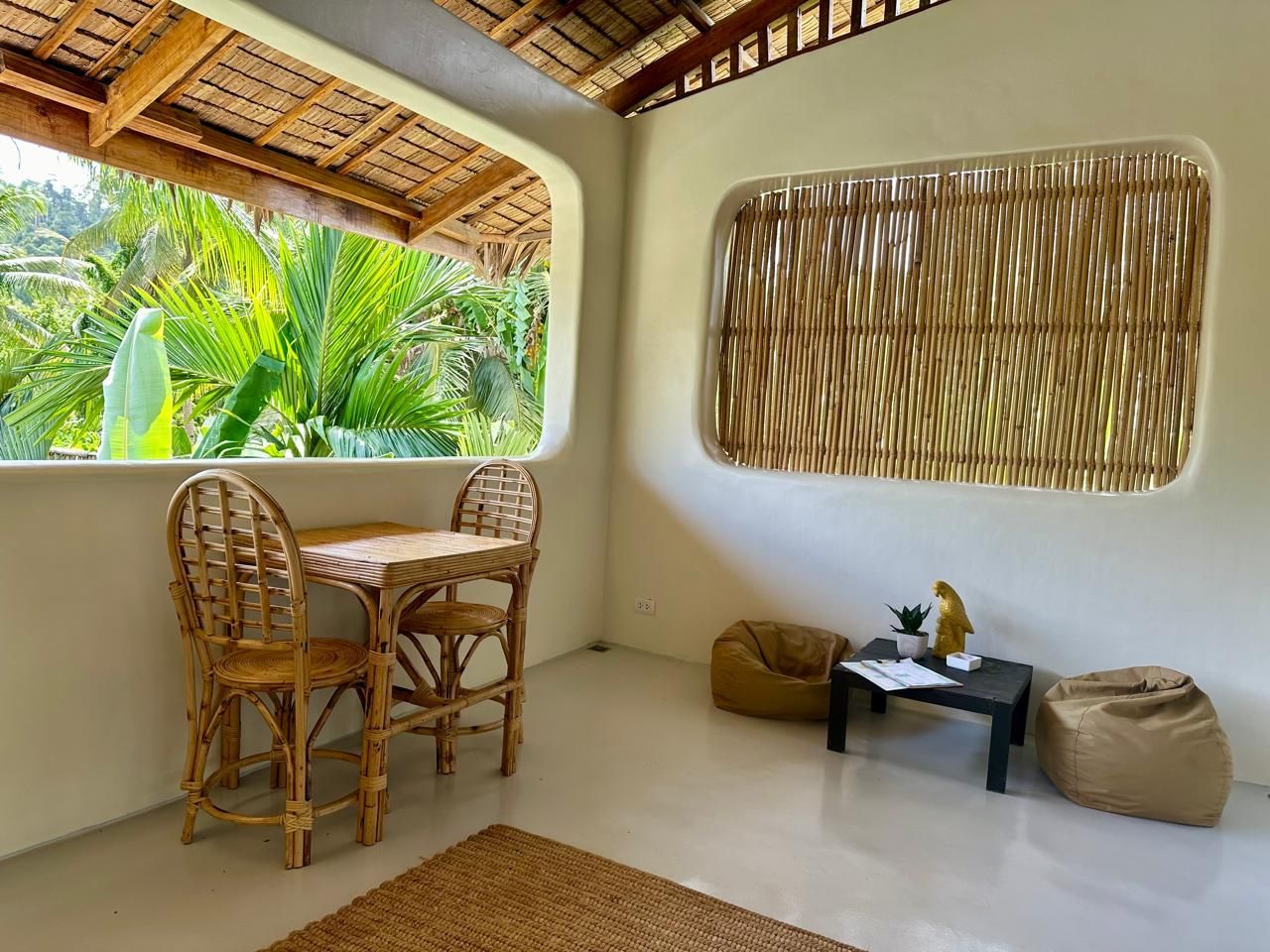 There is a table and chairs on the balcony.