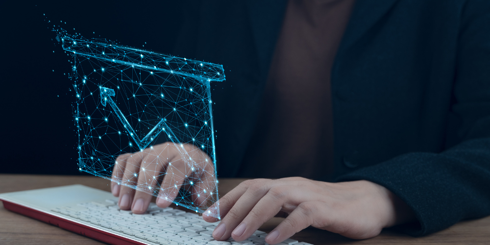 A person is typing on a laptop computer with a graph coming out of it.