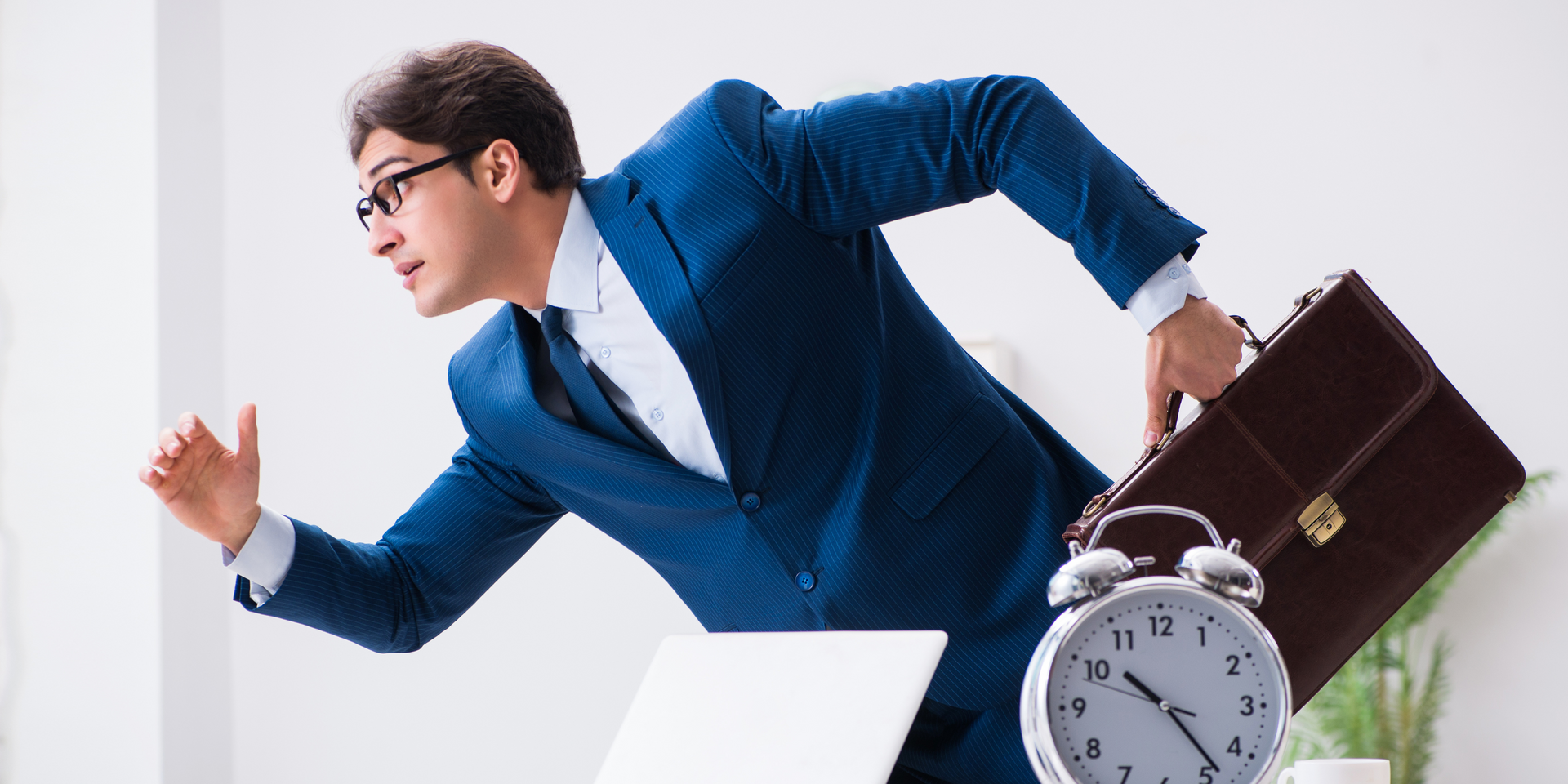 A person is holding a clock in their hand
