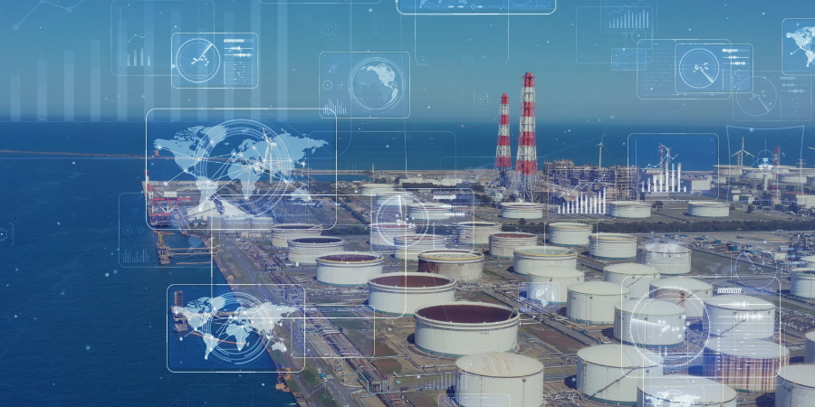 An aerial view of a large oil refinery next to the ocean.