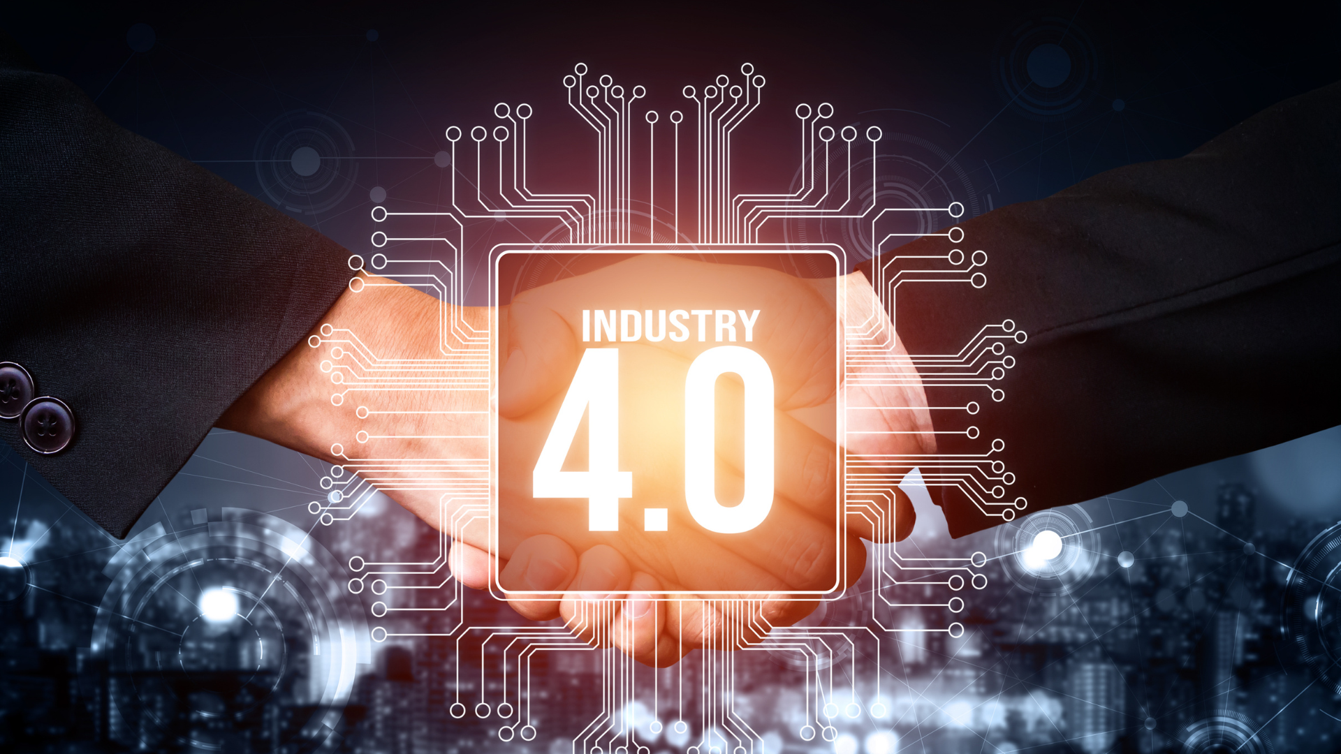 Two people are shaking hands in front of a screen that says industry 4.0.