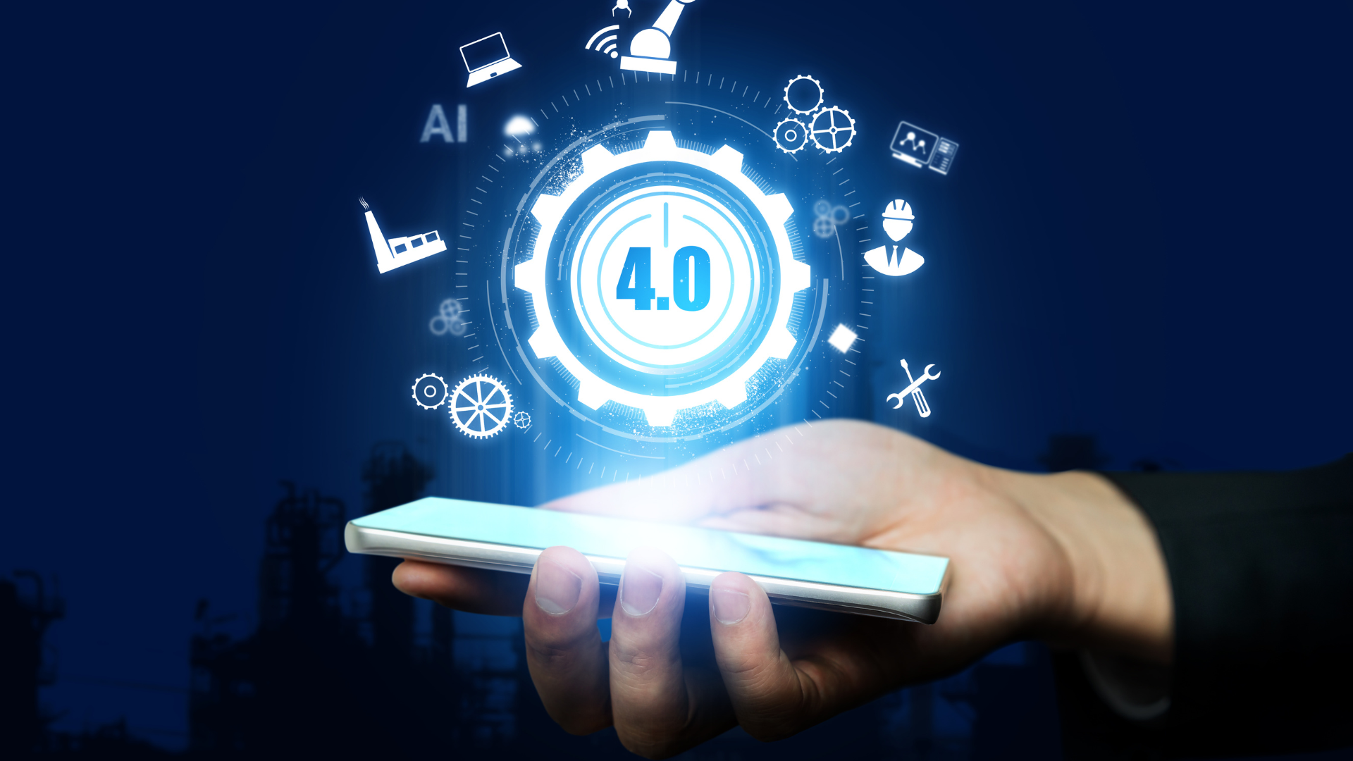A person is holding a cell phone in their hand with a gear coming out of it.